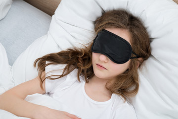 Girl Sleeping On Bed With Sleep Mask