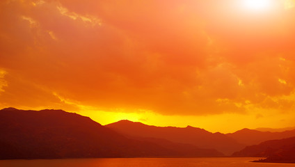 calm evening landscape with lake and mountains