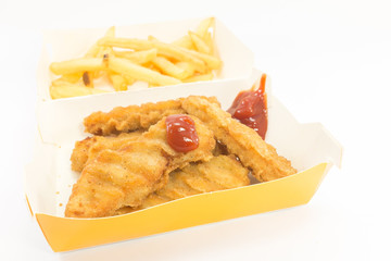Nuggets serve with french fries in box on isolated background.