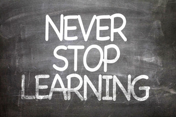 Never Stop Learning written on a chalkboard