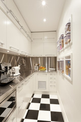 Small white coloured kitchen