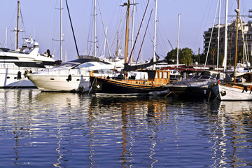 boats in a port with water reflections