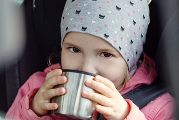 Happy Toddler girl in the car