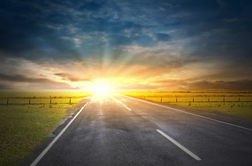 Sunrise above road