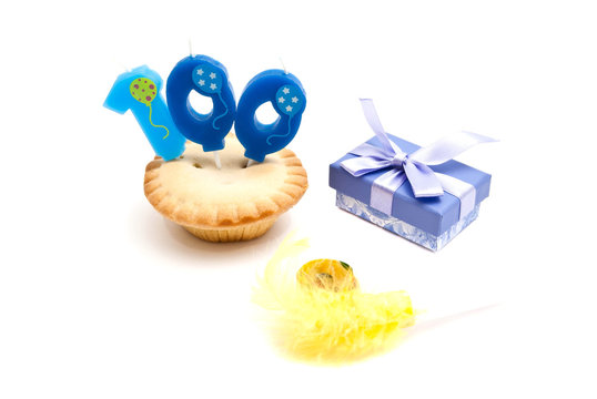 cupcake with one hundred years birthday candle, gift and whistle