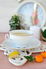 Still life with cup of tea and marzipan