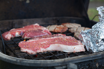 T-Bone Steaks on Charcoal Grill