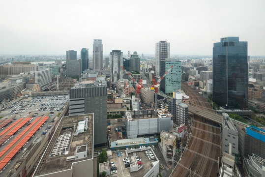 The sky is overcast. City view umeda station Osaka Japan