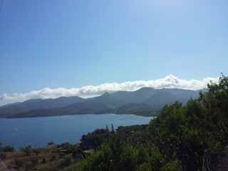Naklejka na ściany i meble The hills, the clouds and the sea of Elba island, Italy.