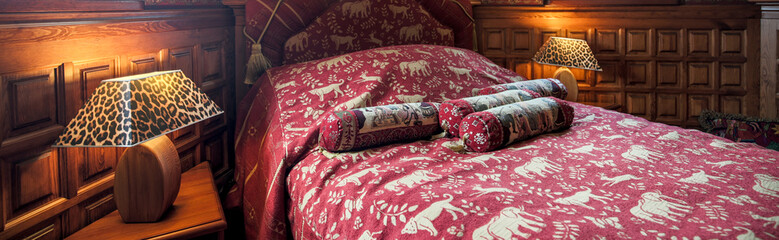 Comfortable bed in baroque bedroom