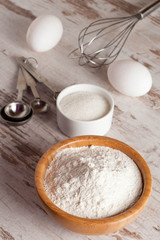 Fototapeta na wymiar ingredients and tools to make a cake, flour, sugar,eggs