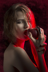 provocative girl biting apple