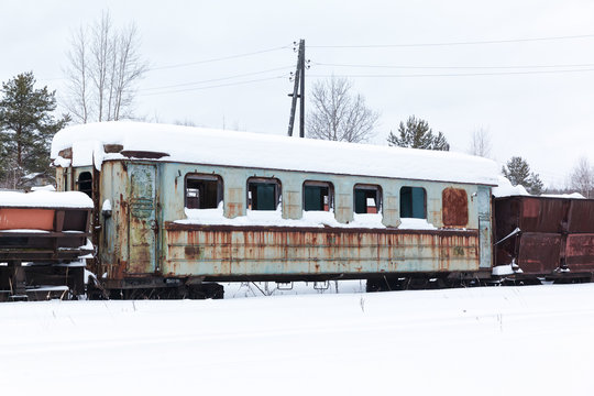 Abandoned  rusty  wagons on narrow-gauge railway