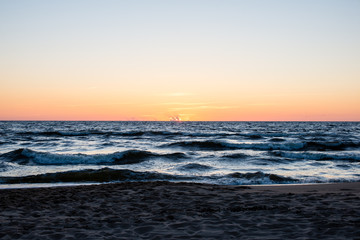 red dramatic sunset on the sea beach