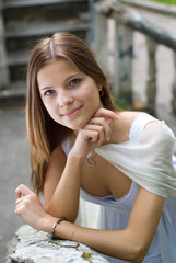 Lady in white dress with pendant