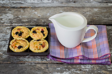 Milk and cookies on a wooden table