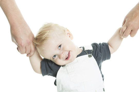 Beautiful  Baby Learning To Walk Isolated On A White Background