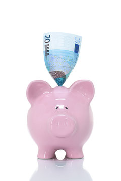 European Union Currency in a pink piggy bank