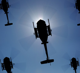 Helicopter silhouette in the sky