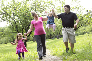 Obraz premium family in forest having fun together