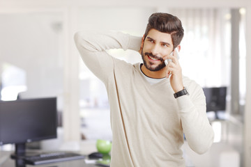 Young businessman with mobile