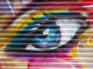 Painted Wall: Colorful Abstract Eye in Detail of Graffiti