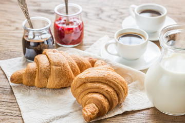 Croissants with cups of coffee