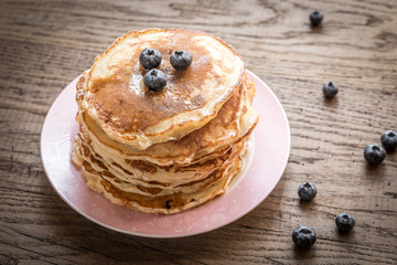 Pancakes with maple syrup and fresh bluberries