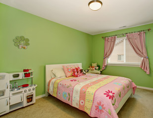 Perfect girls bedroom with green walls.