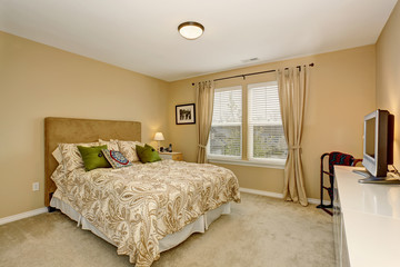 Elegant bedroom with patterned bedding.