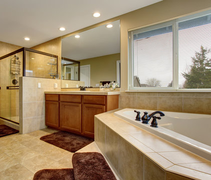 Gorgeous bathroom with glass shower, and large bath.