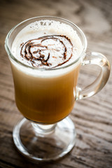 Glass mug with cappuccino