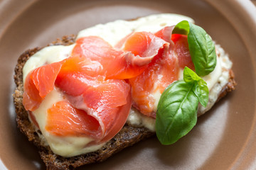 Sandwich with trout, mozzarella and tomatoes