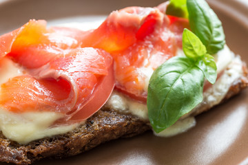 Sandwich with trout, mozzarella and tomatoes