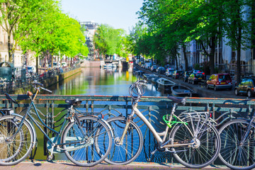 Fototapeta na wymiar Colorful bikes on the bridge in Amsterdam, Netherlands