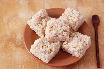 Coconut candy cocada on brown plate