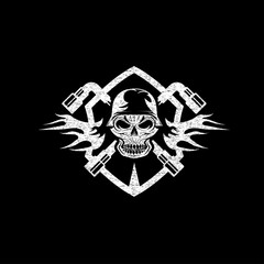 crest with skull in helmet and spanners