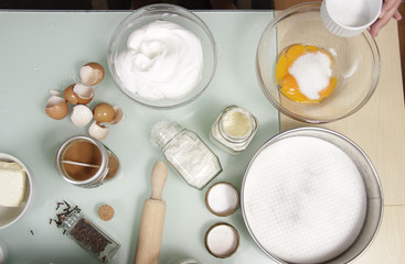 Kitchen table full of ingredients, for cake.