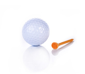 Golf ball with tee  isolated on white background with