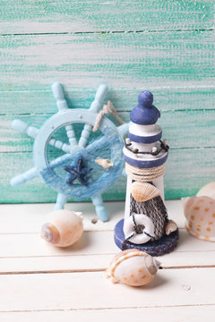 Decorative lighthouse,  helm and marine items