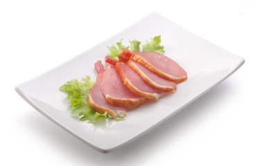 Slices of pork balyk on the plate