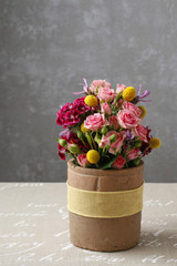 Romantic floral arrangement with roses and carnations