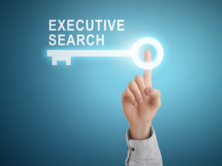 male hand pressing executive search key button