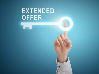 male hand pressing extended offer key button