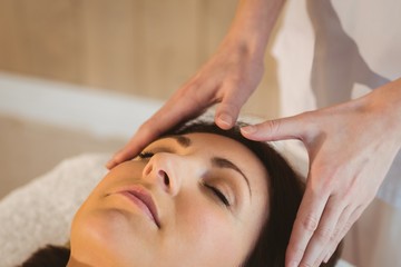 Young woman having a reiki treatment