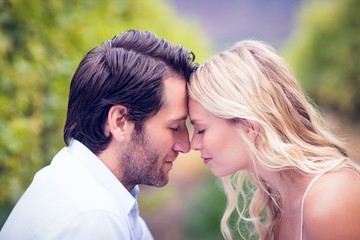 Naklejka premium Young happy couple sitting face to face