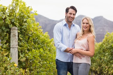 Young happy couple smiling at camera