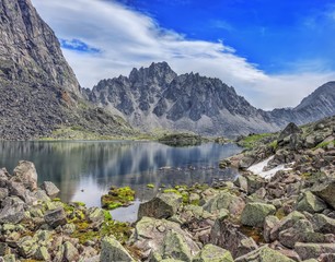 Huge pieces of granite on the lake in the mountains of Eastern Siberia