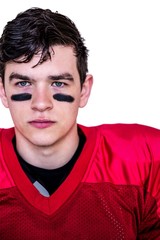 Serious american football player looking at camera 