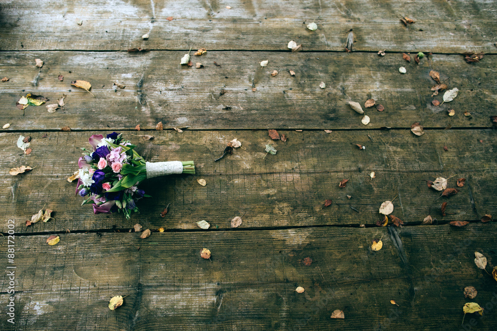 Wall mural pink and white wedding bouquet on the wood table